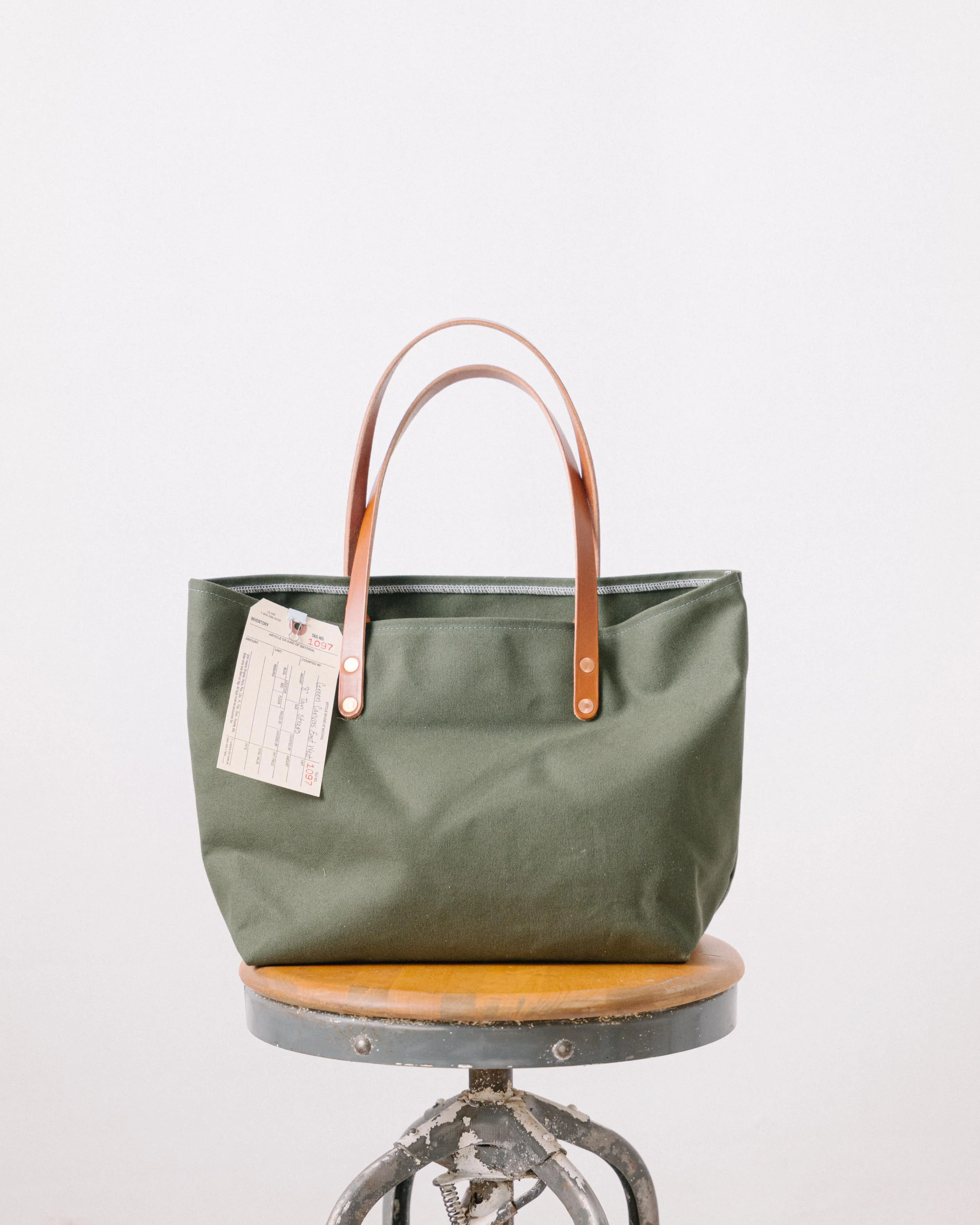 1097 Green Canvas East West Tote -7” Tan Straps